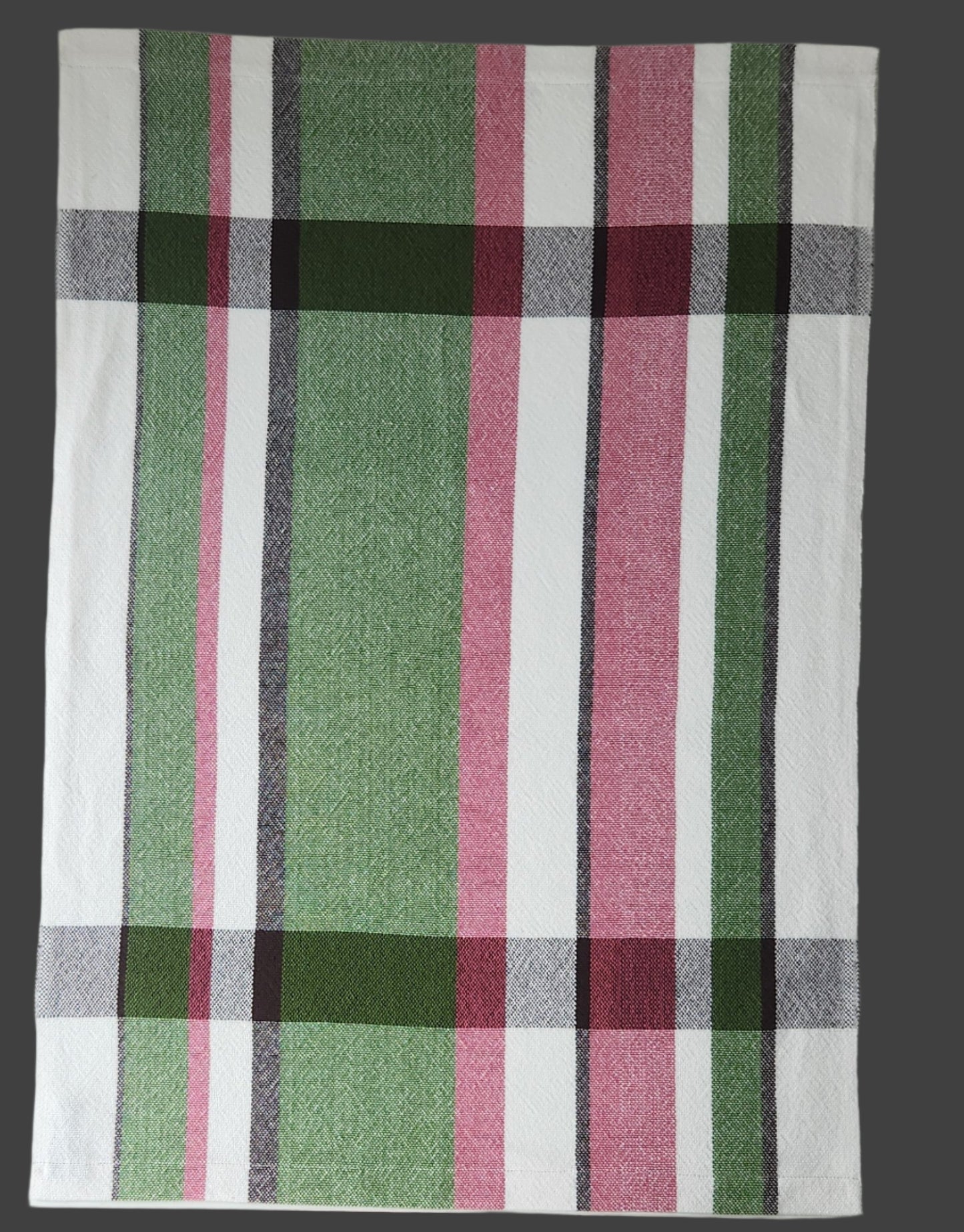 Plaid towel with green, pink, and gray stripes on a white background