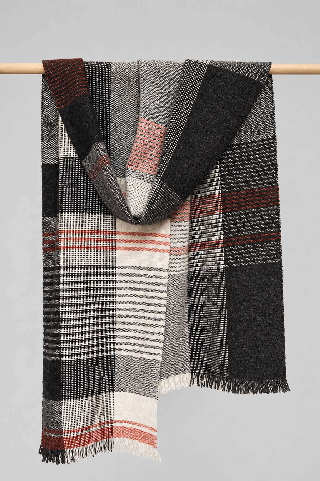 scarf hanging on a wooden rod